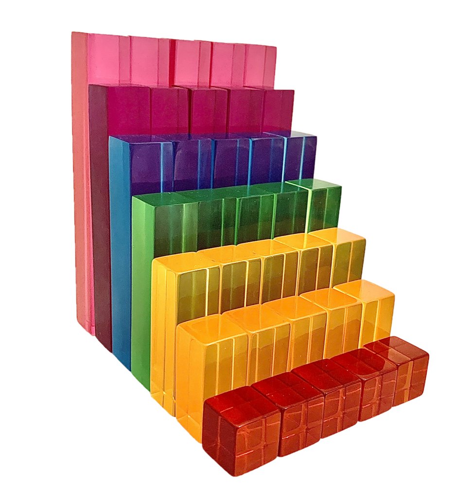 A set of coloured lucite rods.  Smallest block (cube) is red, then orange, yellow, green, blue, purple and pink.  There are 5 block of each colour.